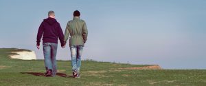 Two people walking hand in hand